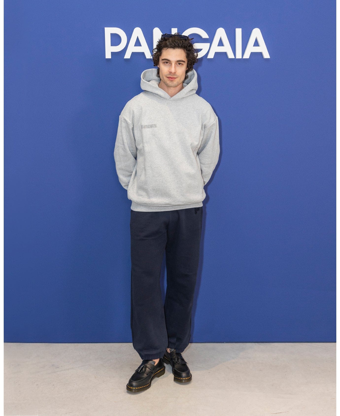 Men's heather grey oversized pullover hoodie, cotton blend, and navy relaxed fit sweatpants with elasticated cuffs
