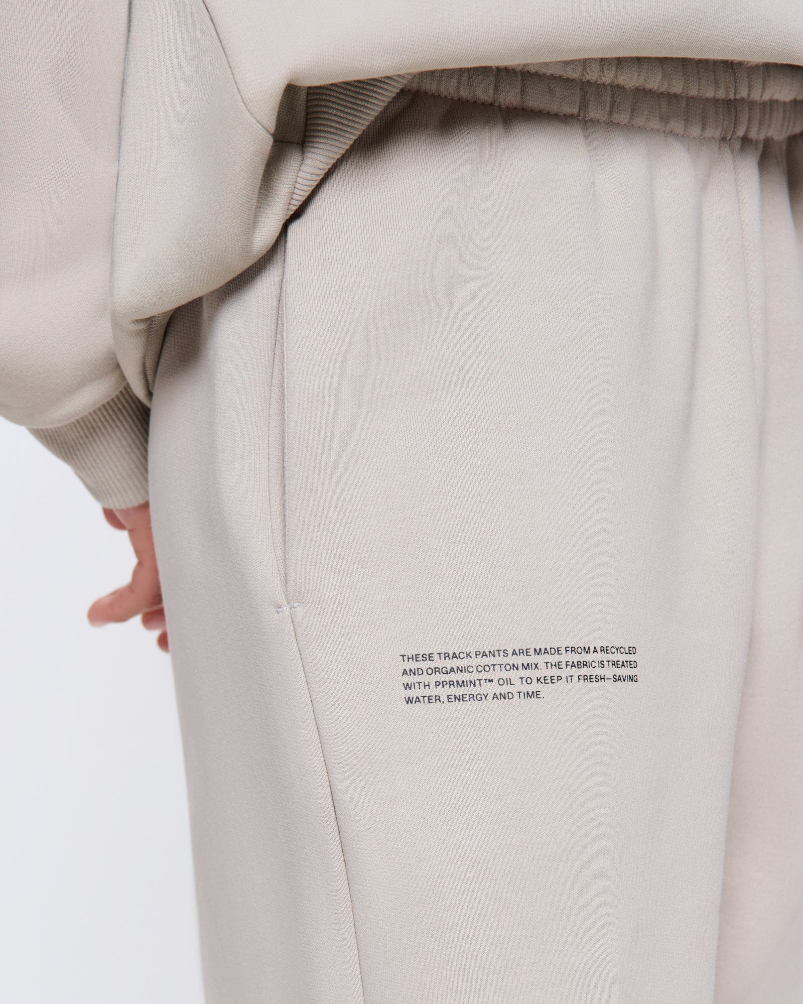 365_HEAVYWEIGHT_TRACK-PANTS_STONE_WOMENS_DETAIL-MODEL