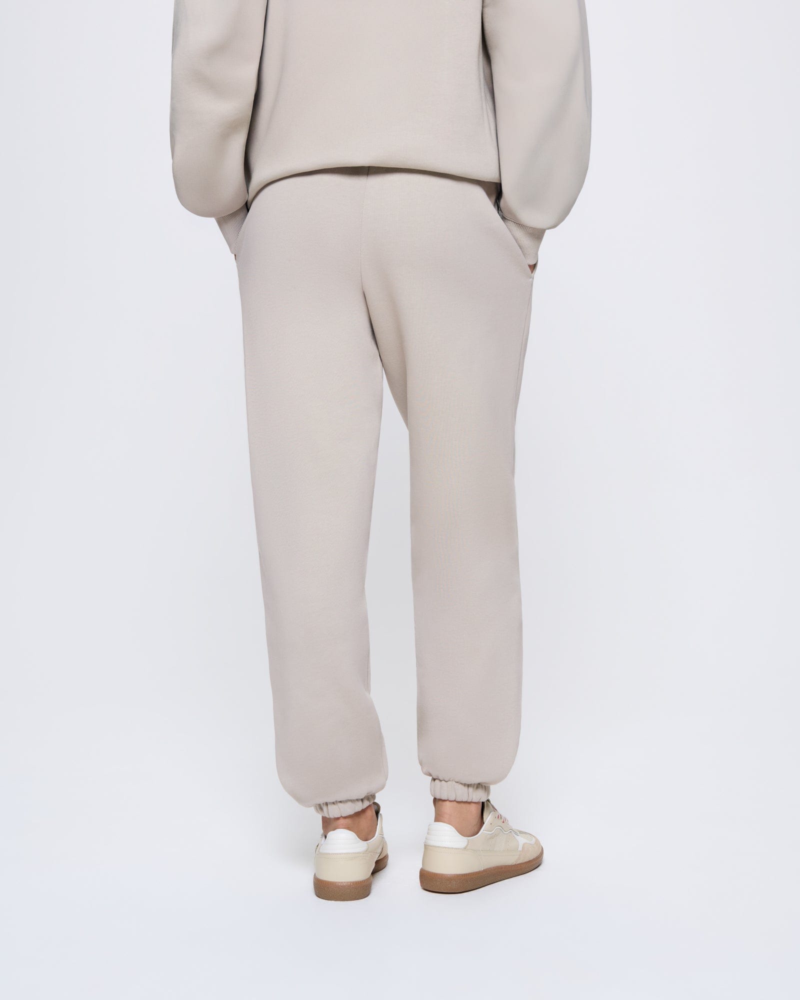 365_HEAVYWEIGHT_TRACK-PANTS_STONE_WOMEN_BACK-MODEL