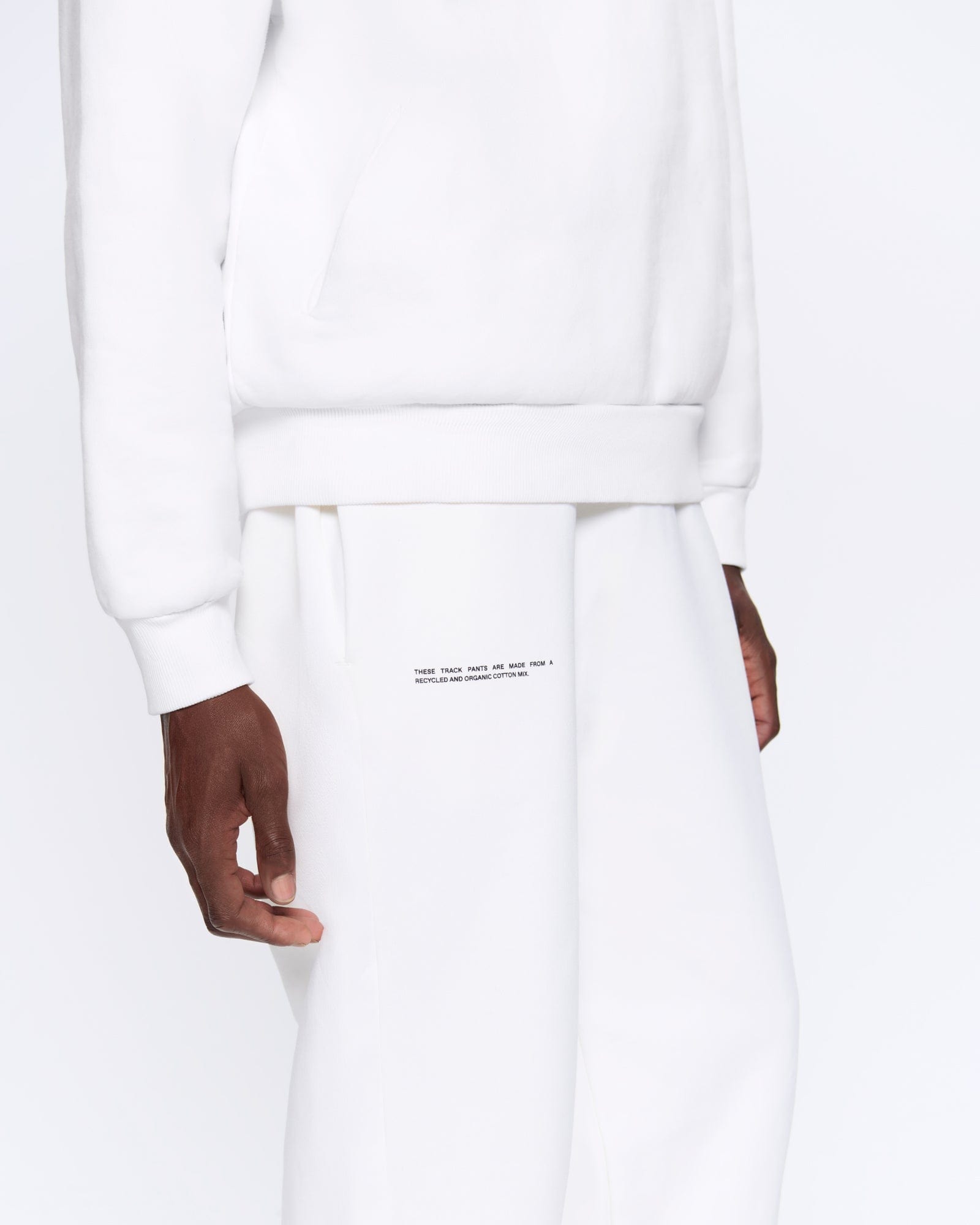 365_HEAVYWEIGHT_TRACK_PANTS_OFF_WHITE_MENS_DETAIL-MODEL