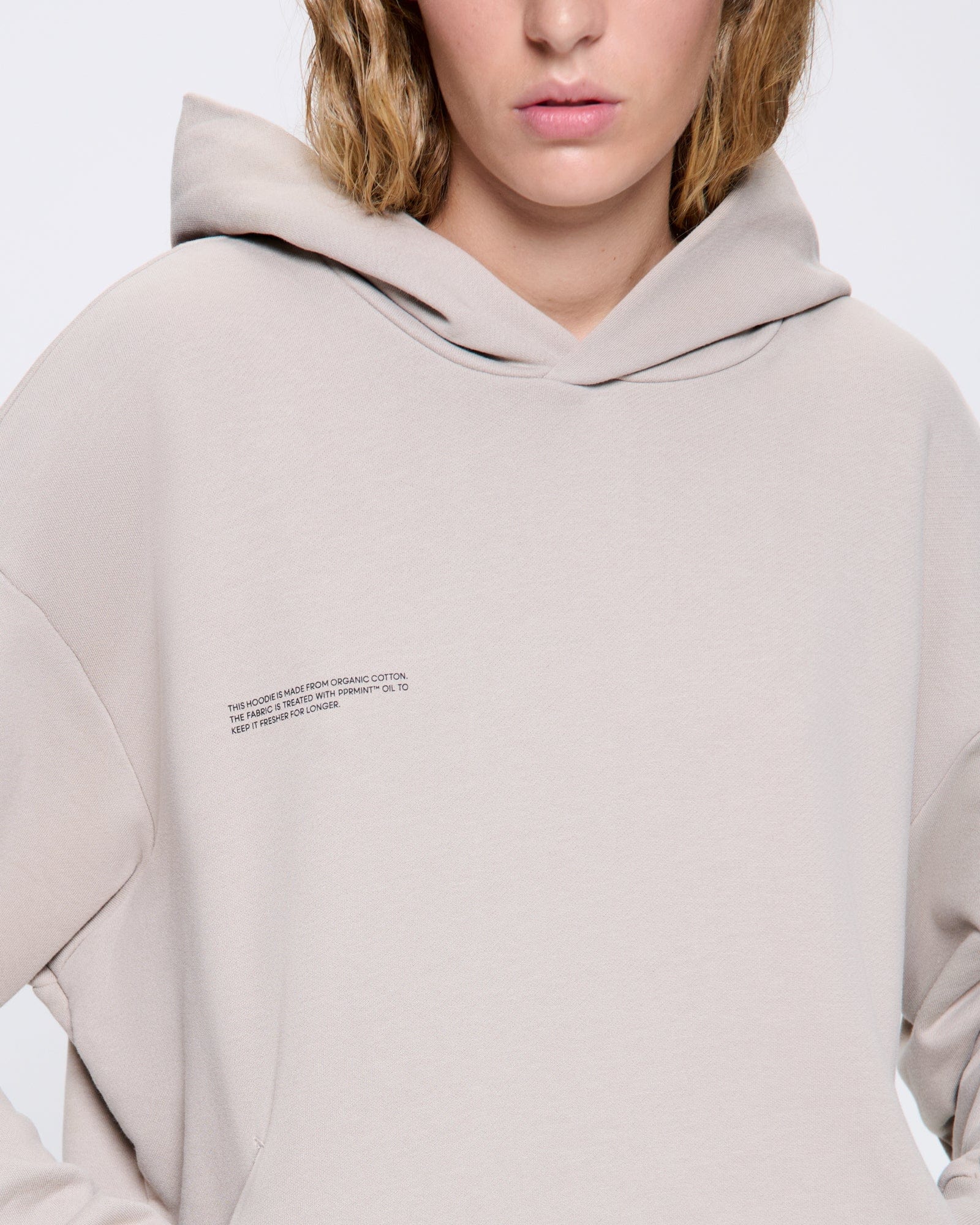 365_MIDWEIGHT_HOODIE_STONE_WOMENS_DETAIL_cc7494bf-09ba-4bb3-b9c6-595f7058af30-MODEL