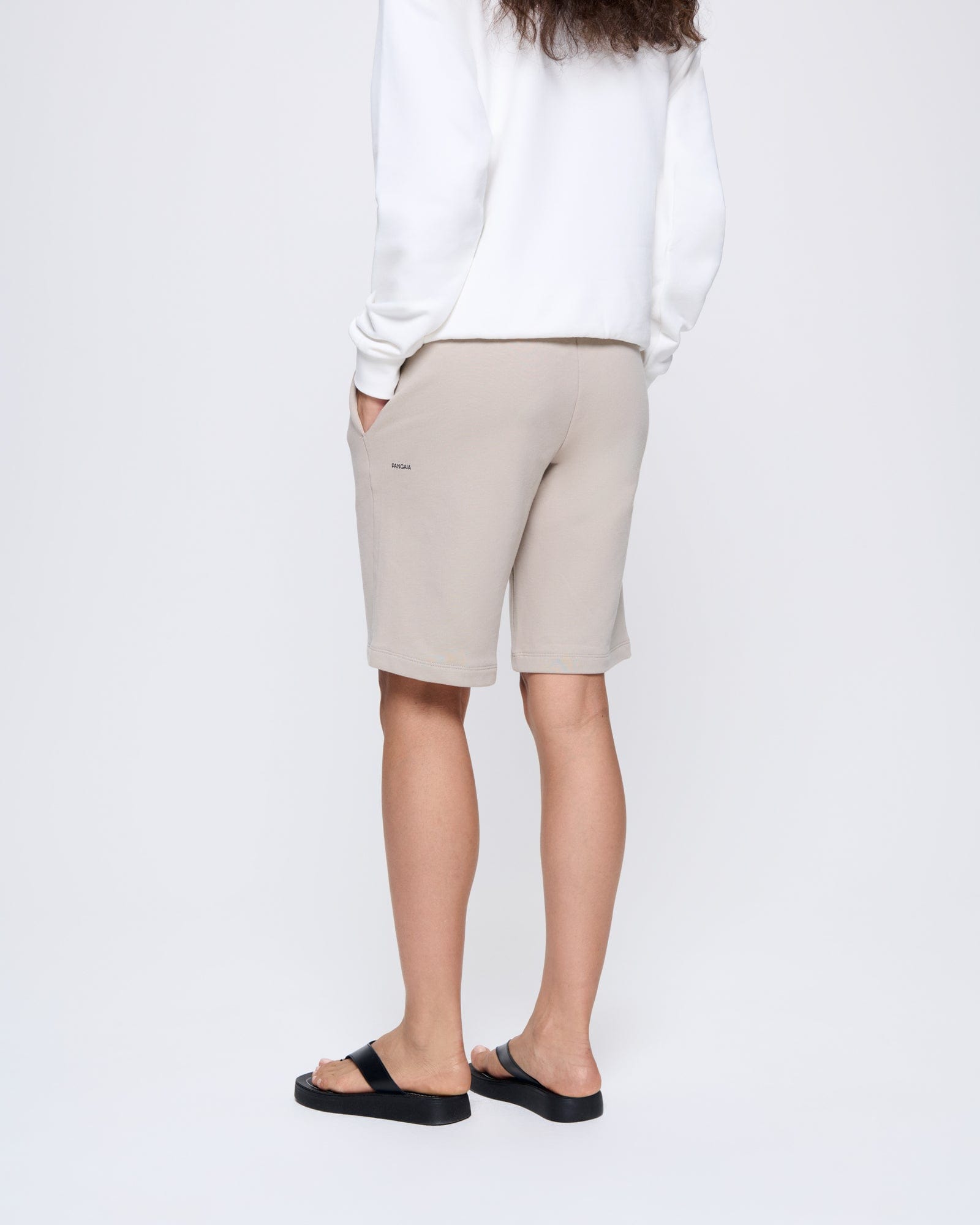 365_MIDWEIGHT_LONG-SHORTS_STONE_WOMENS_BACK-MODEL