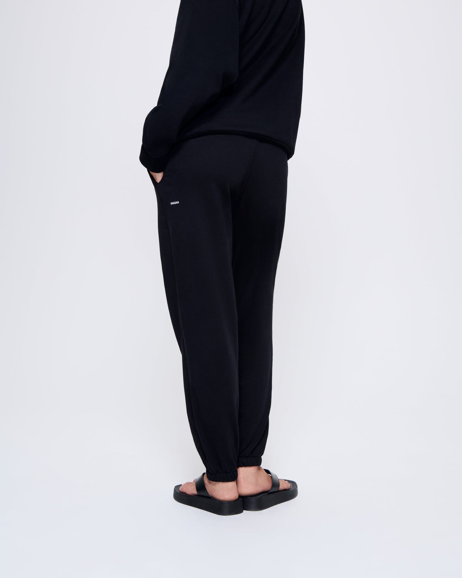 365_MIDWEIGHT_TRACK-PANTS_BLACK_WOMENS_BACK-MODEL