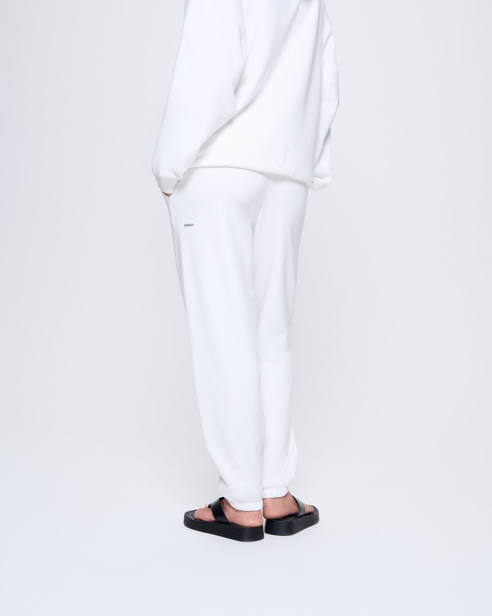 365_MIDWEIGHT_TRACK-PANTS_OFF-WHITE_WOMENS_BACK-MODEL