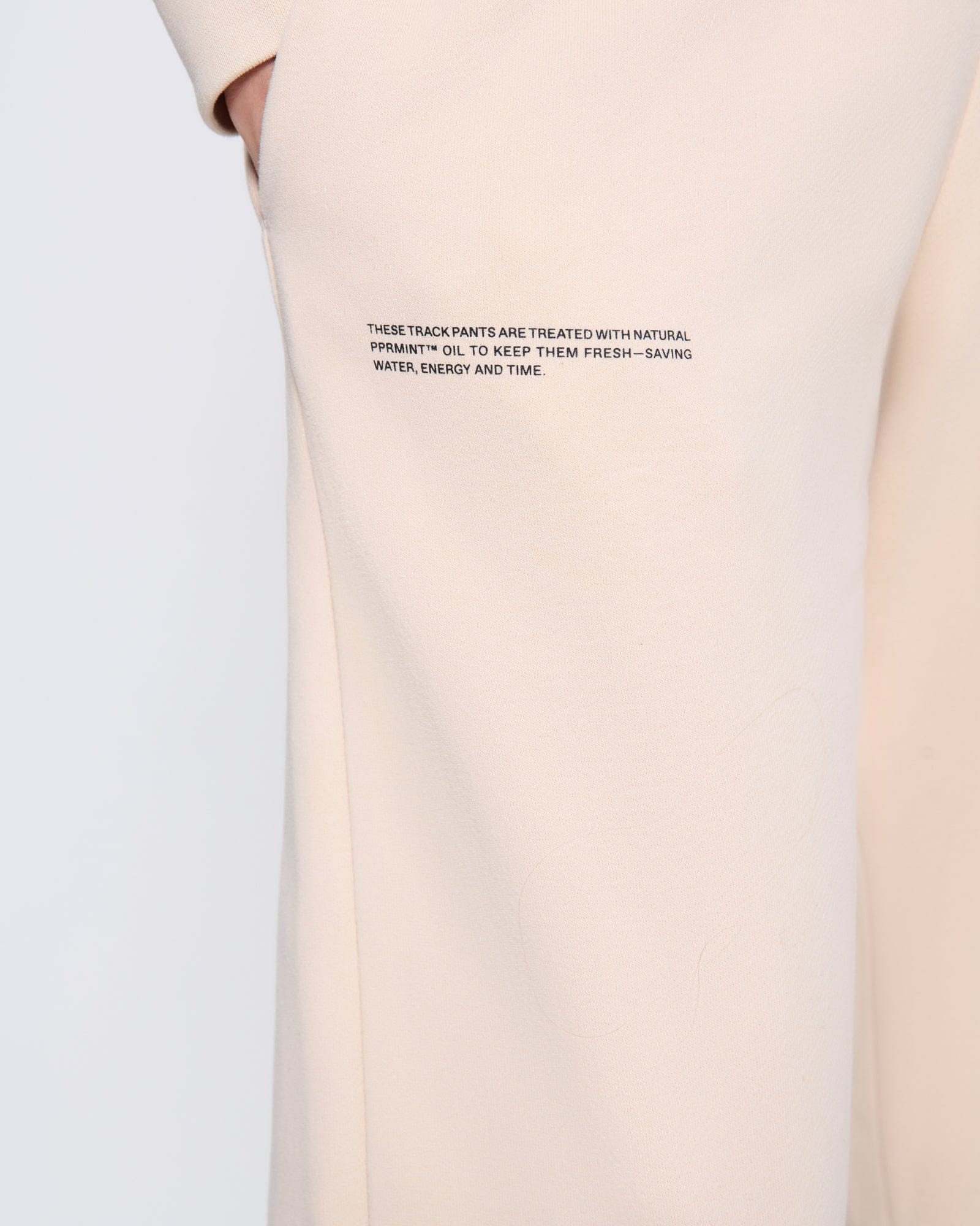 365_MIDWEIGHT_TRACK-PANTS_SAND_WOMENS_DETAIL-MODEL