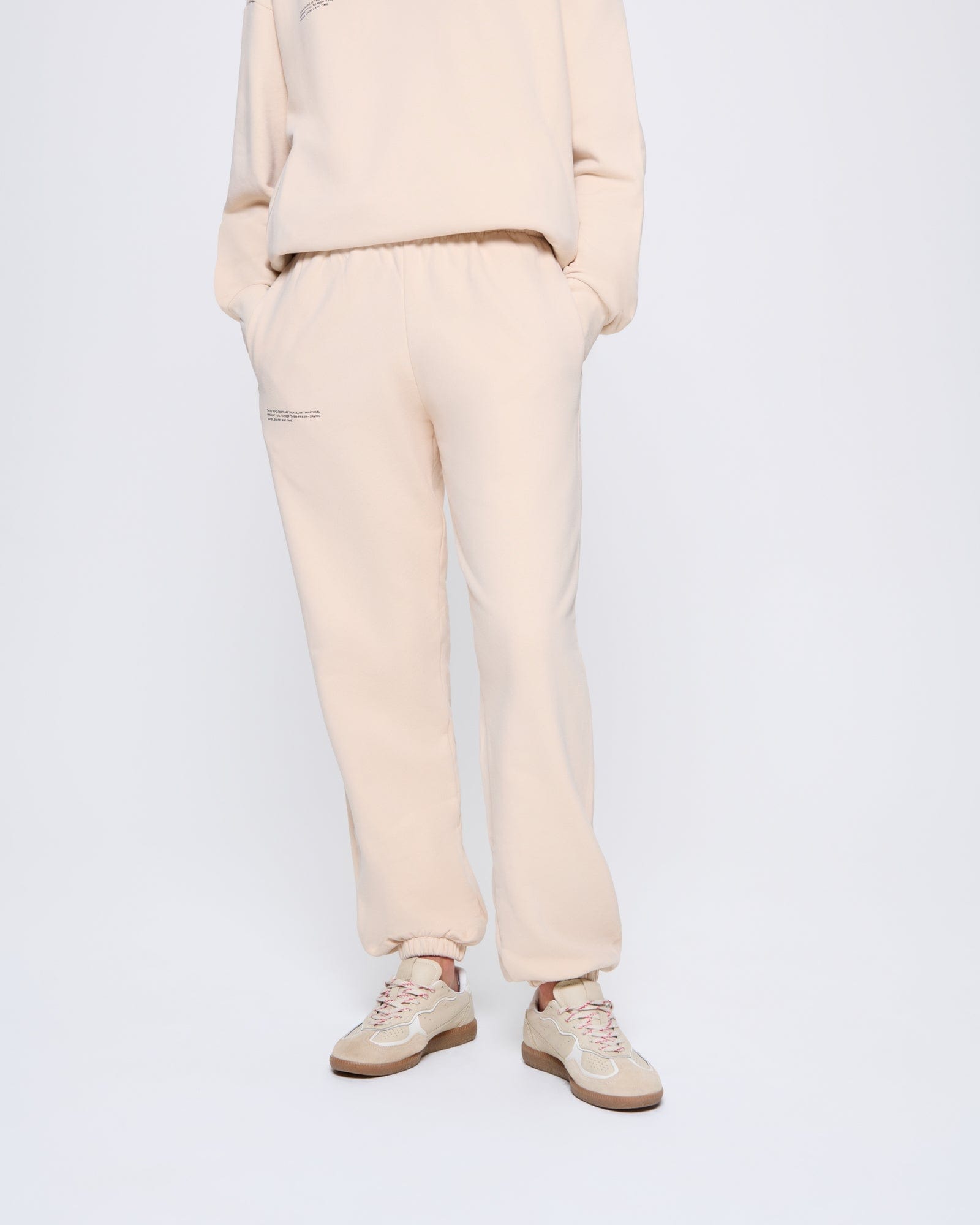 365_MIDWEIGHT_TRACK-PANTS_SAND_WOMENS_FRONT-MODEL