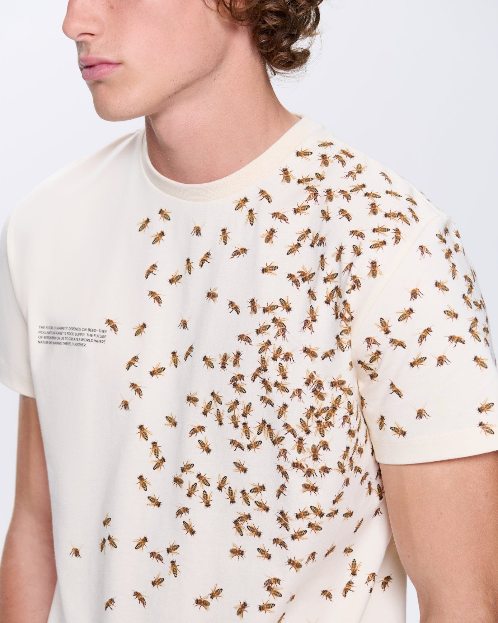 Mens Bee:Wild undyed organic cotton t-shirt. Oversized fit, all-over bee graphic print. Premium casual tee.