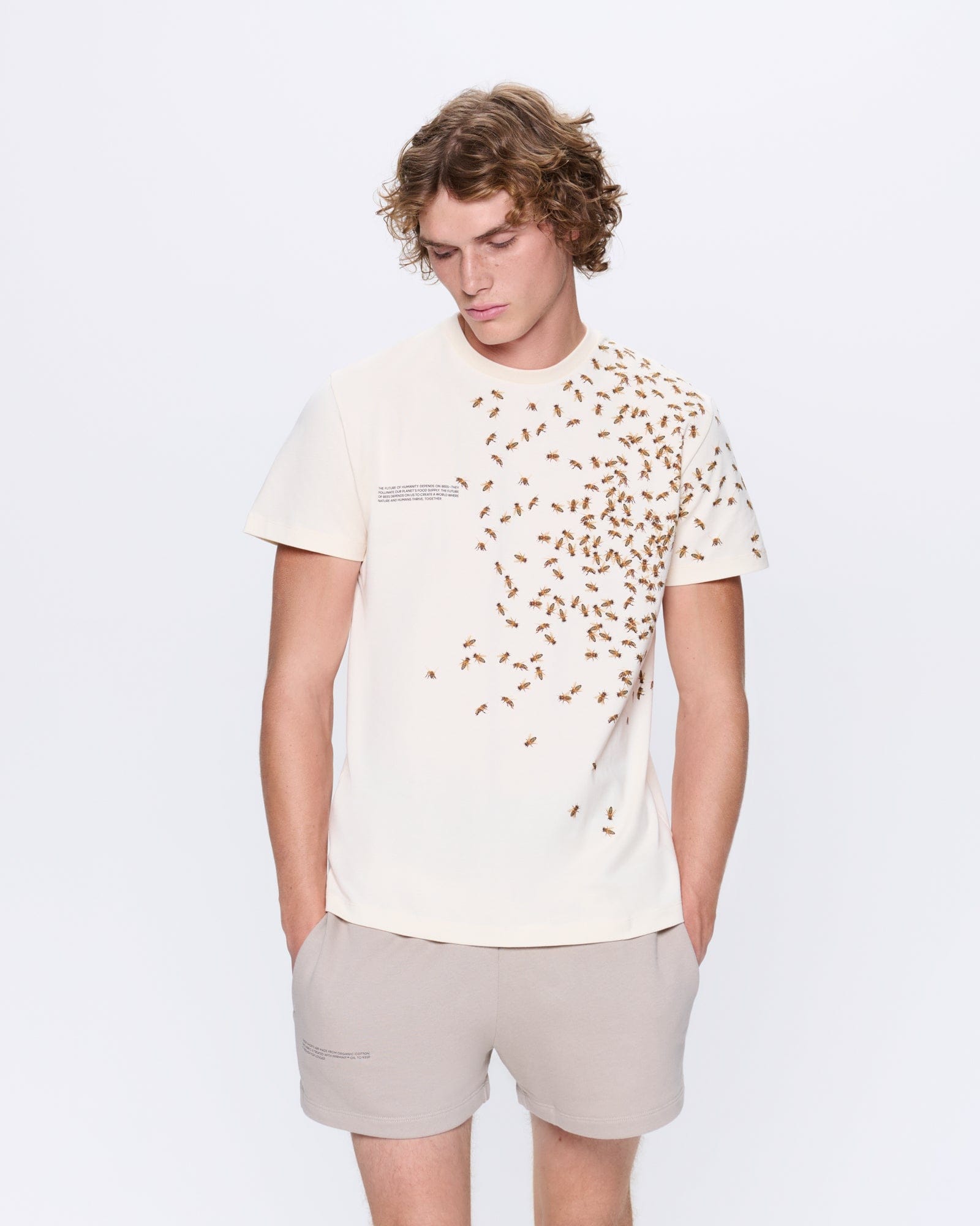 Archive Mens Bee:Wild Undyed Organic Cotton T-shirt. Oversized fit, unique bee print. Worn by model.