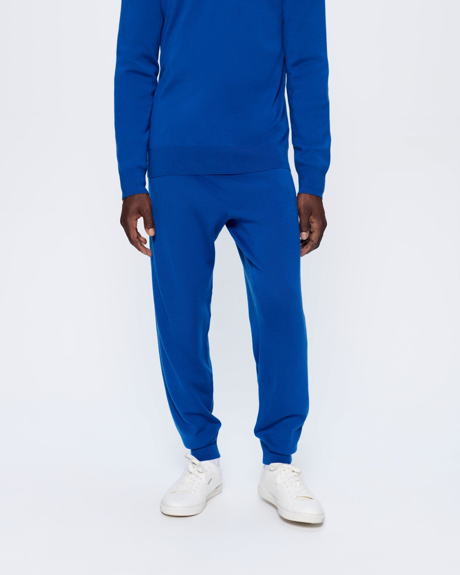 DNA_REGENERATIVE_MERINO_WOOL_TRACK_PANTS_EARTH_BLUE_MENS_FRONT