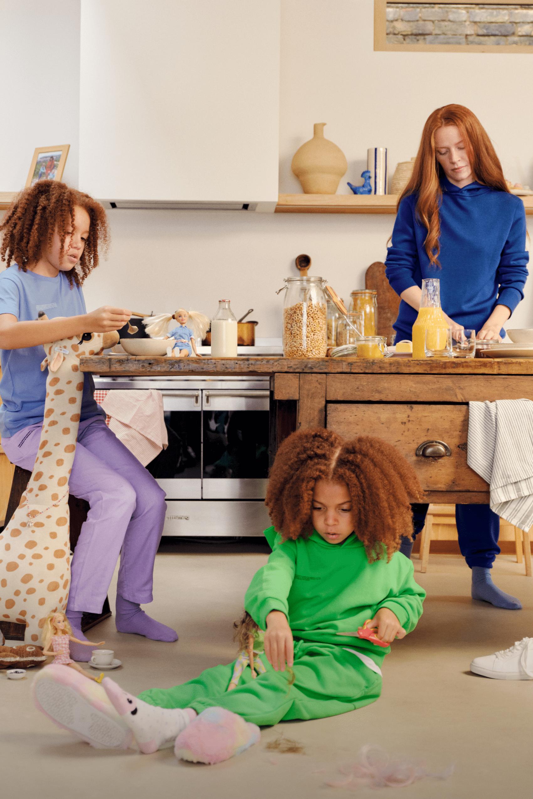 Royal blue youth cotton hoodie & matching sweatpants, green kids' cotton hoodie & sweatpants, light blue tee & purple cotton joggers