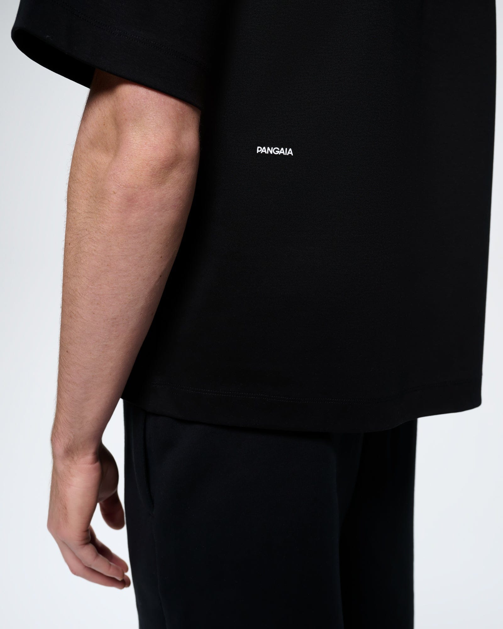 Mens black oversized organic cotton interlock jersey t-shirt with PANGAIA wordmark, ultra-soft, relaxed fit