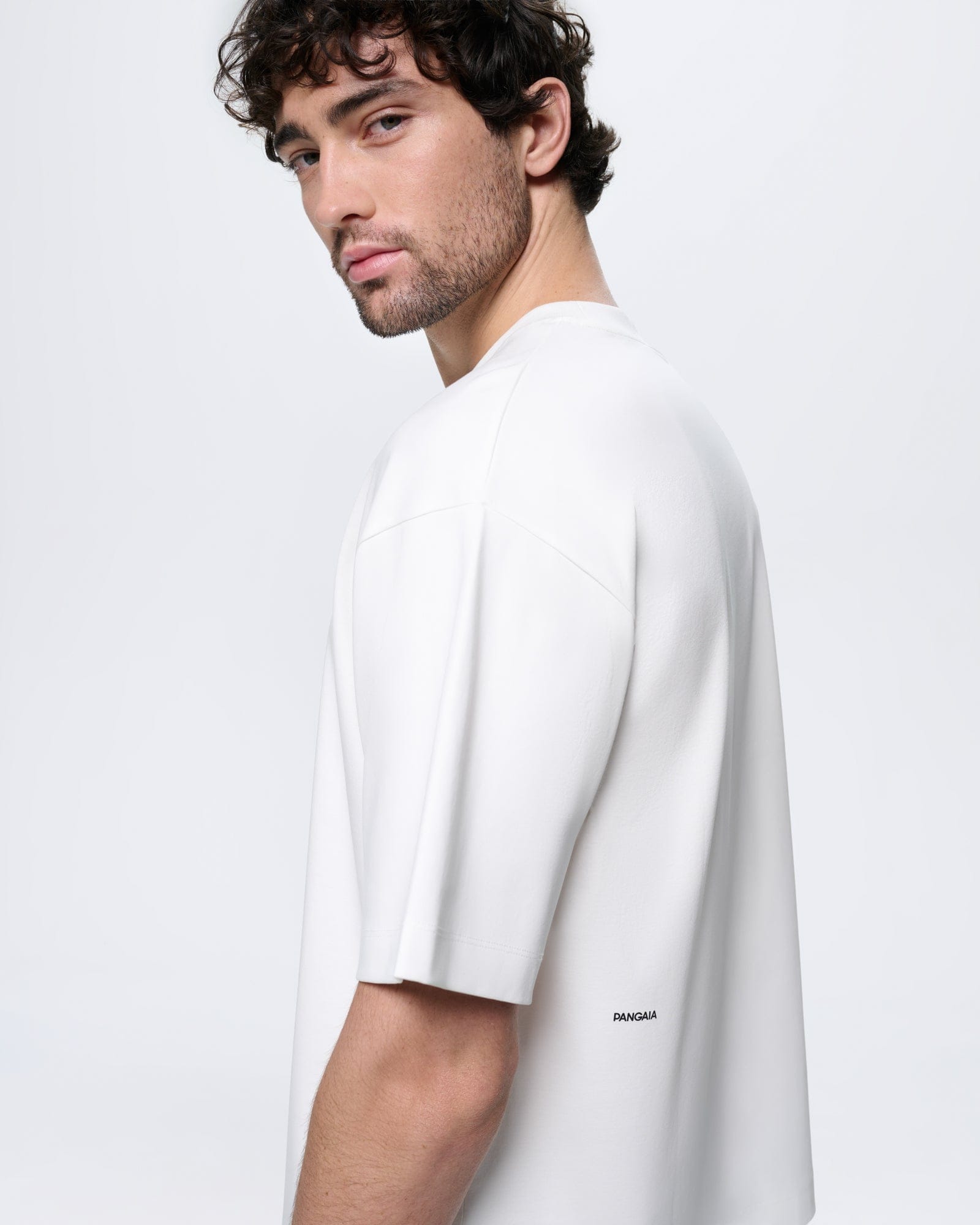 Mens Off-White Oversized Interlock T-Shirt. Ultra-soft organic cotton, relaxed fit, crew neck, PANGAIA wordmark
