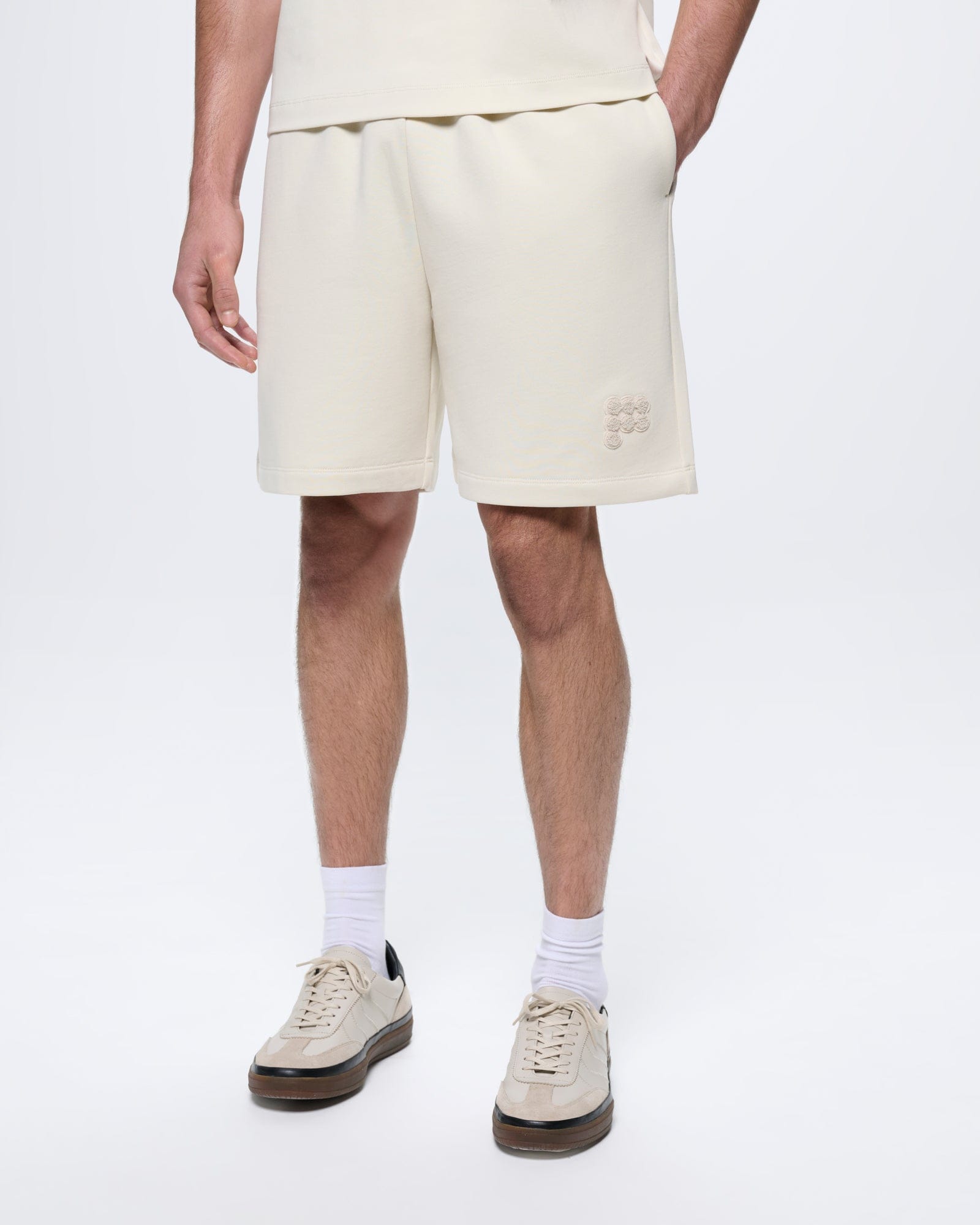Mens Bone White organic cotton mid-length shorts, relaxed fit, with wide waistband, side pockets, and tonal 7 circle P logo