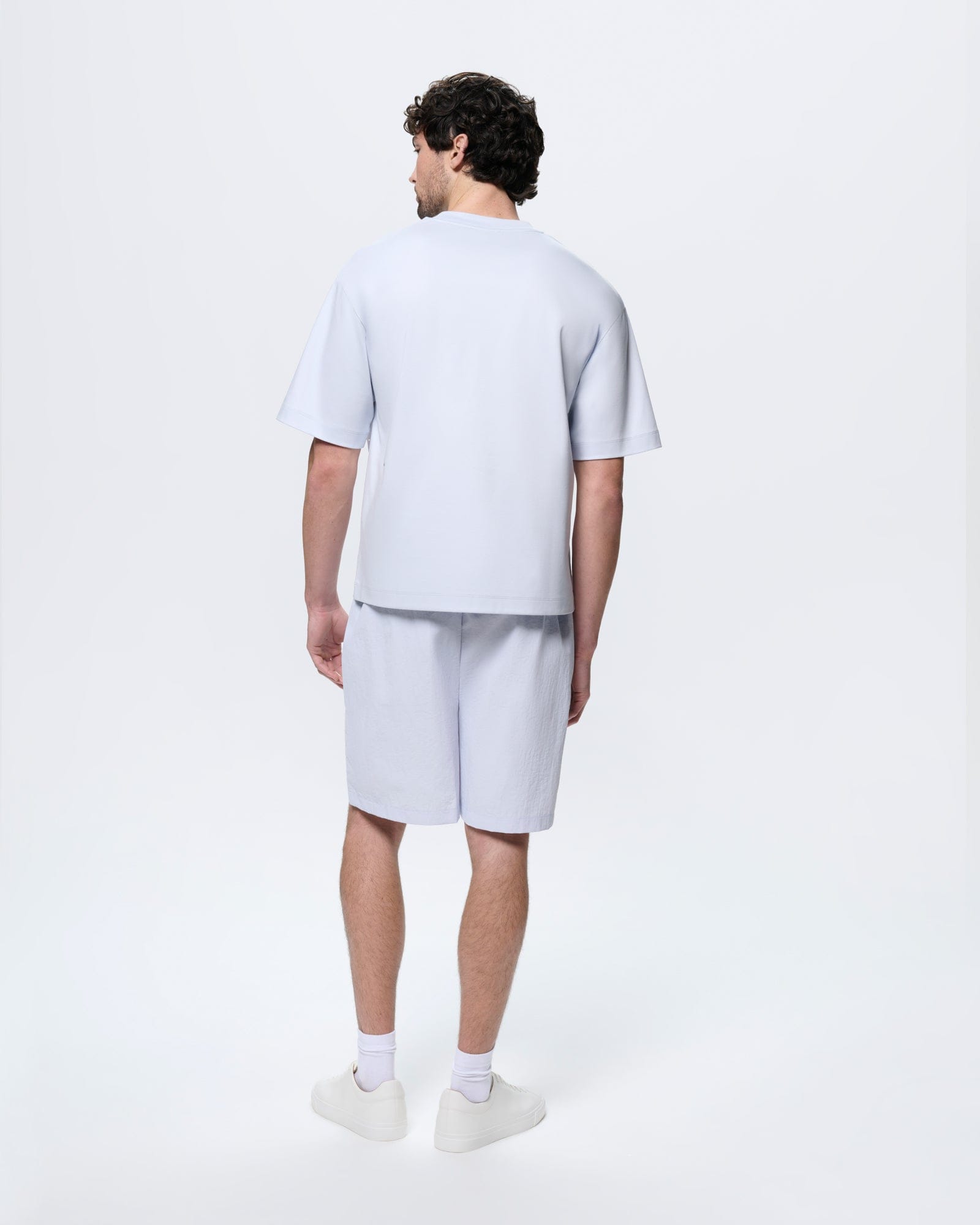 Mens Ice Grey Recycled Nylon Shorts. Mid-length, regular fit, boxy silhouette. Lightweight, breathable 100% recycled polyamide