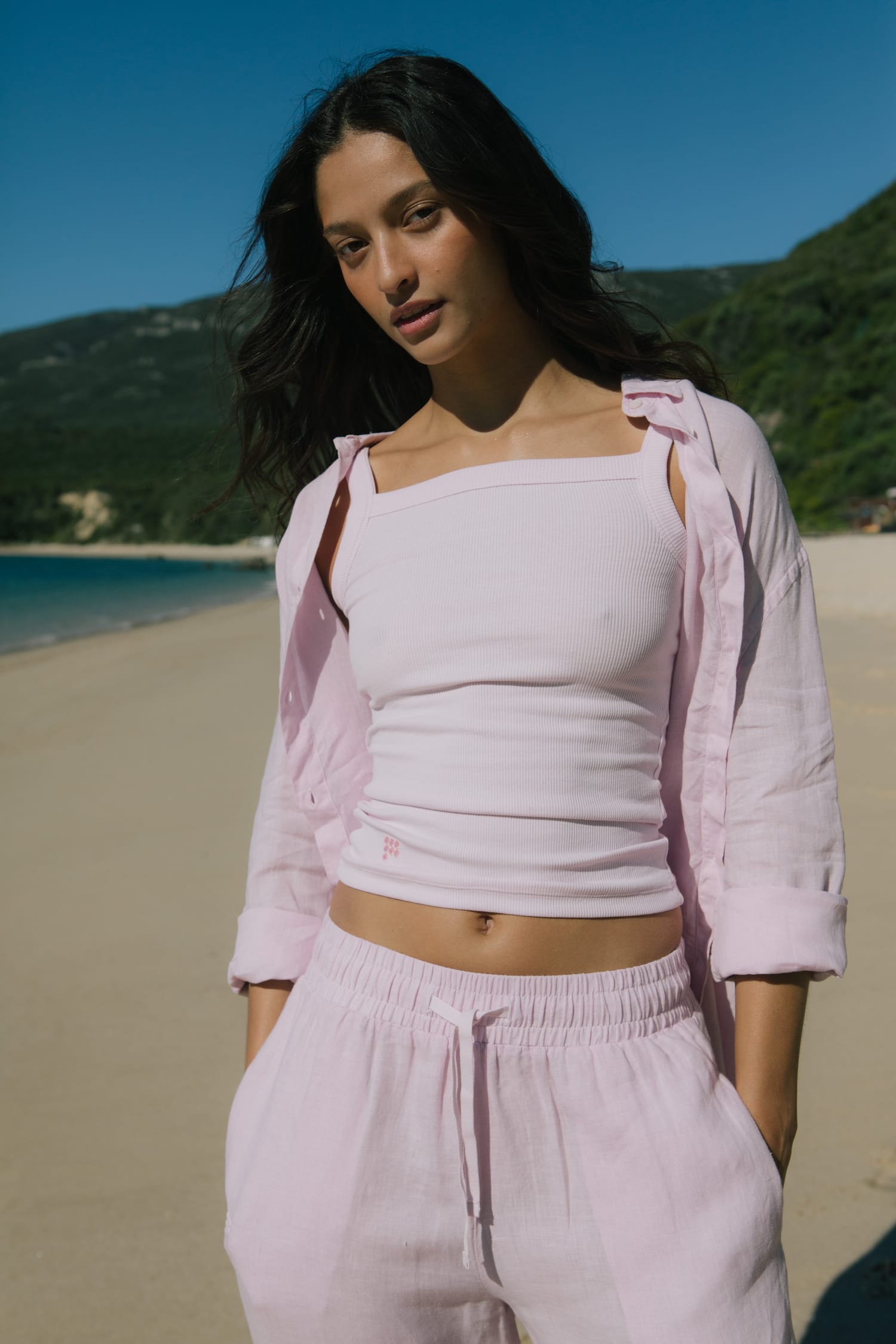Soft pink ribbed square-neck tank top, oversized linen button-up shirt, and relaxed fit linen drawstring lounge pants