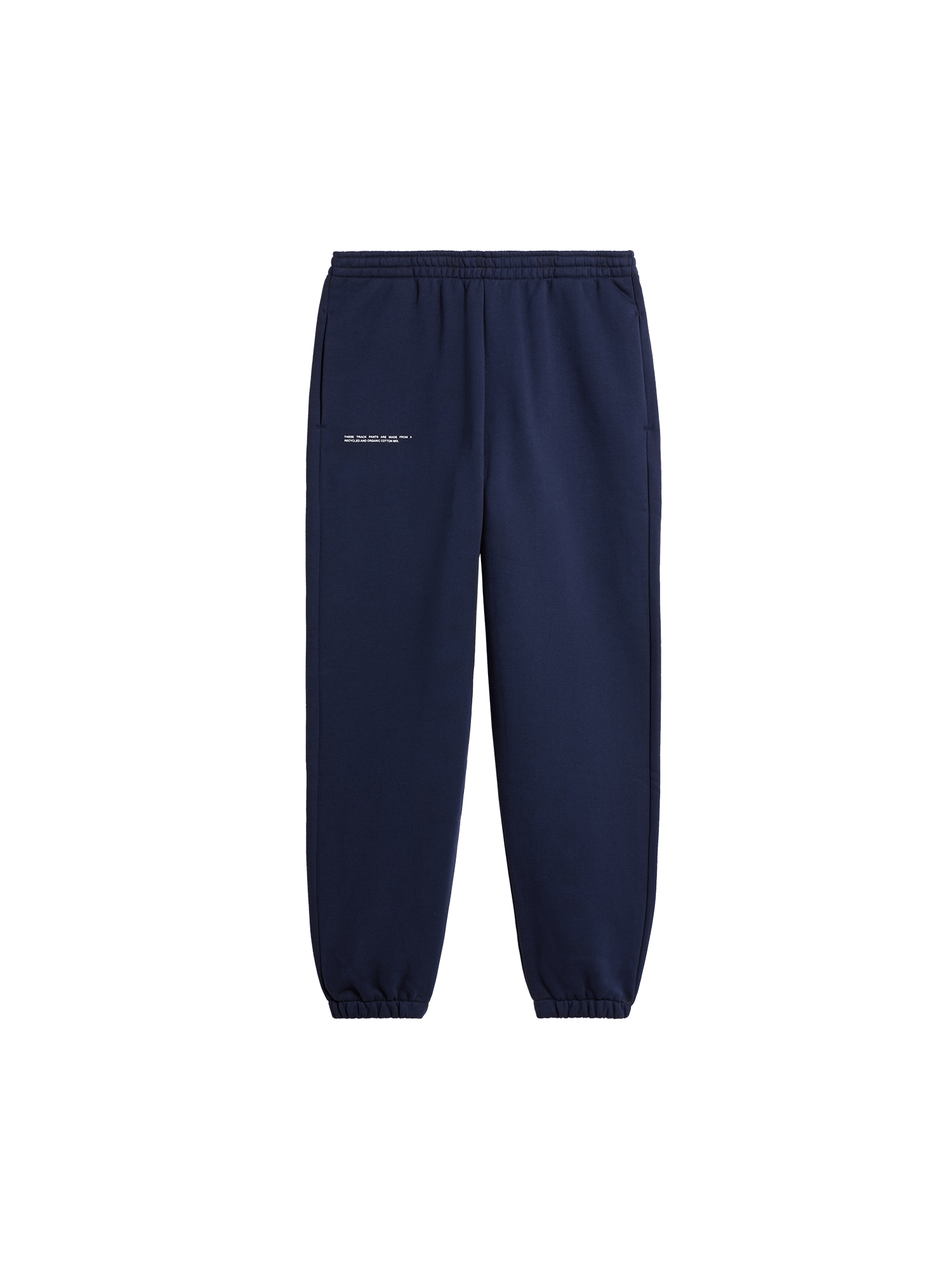 Navy blue track pants packshot. Relaxed fit sweatpants with elasticated waist, cuffed ankles, recycled and organic cotton mix