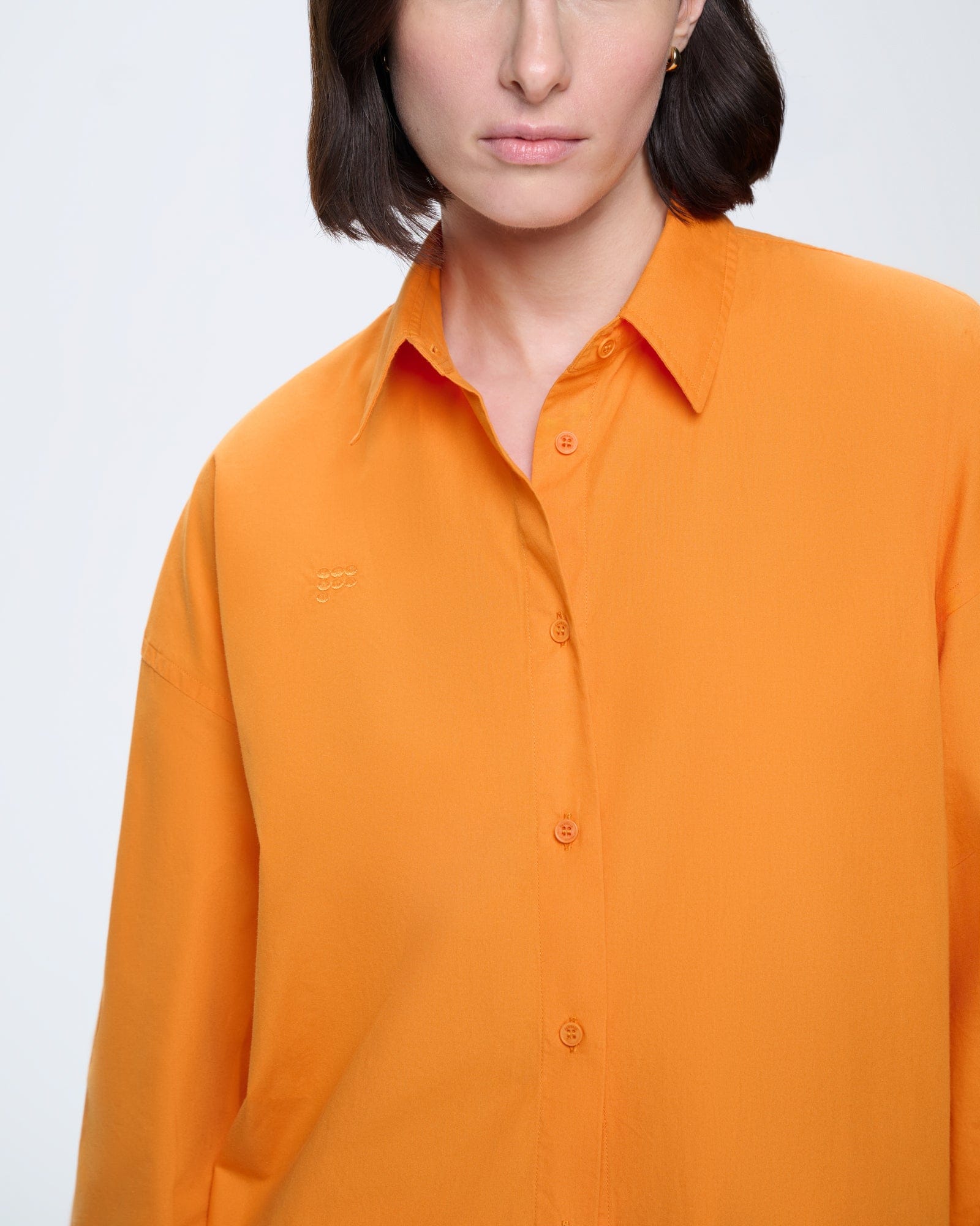 Womens Saffron Orange oversized cotton poplin overshirt with front button fastenings, collar, and tonal logo