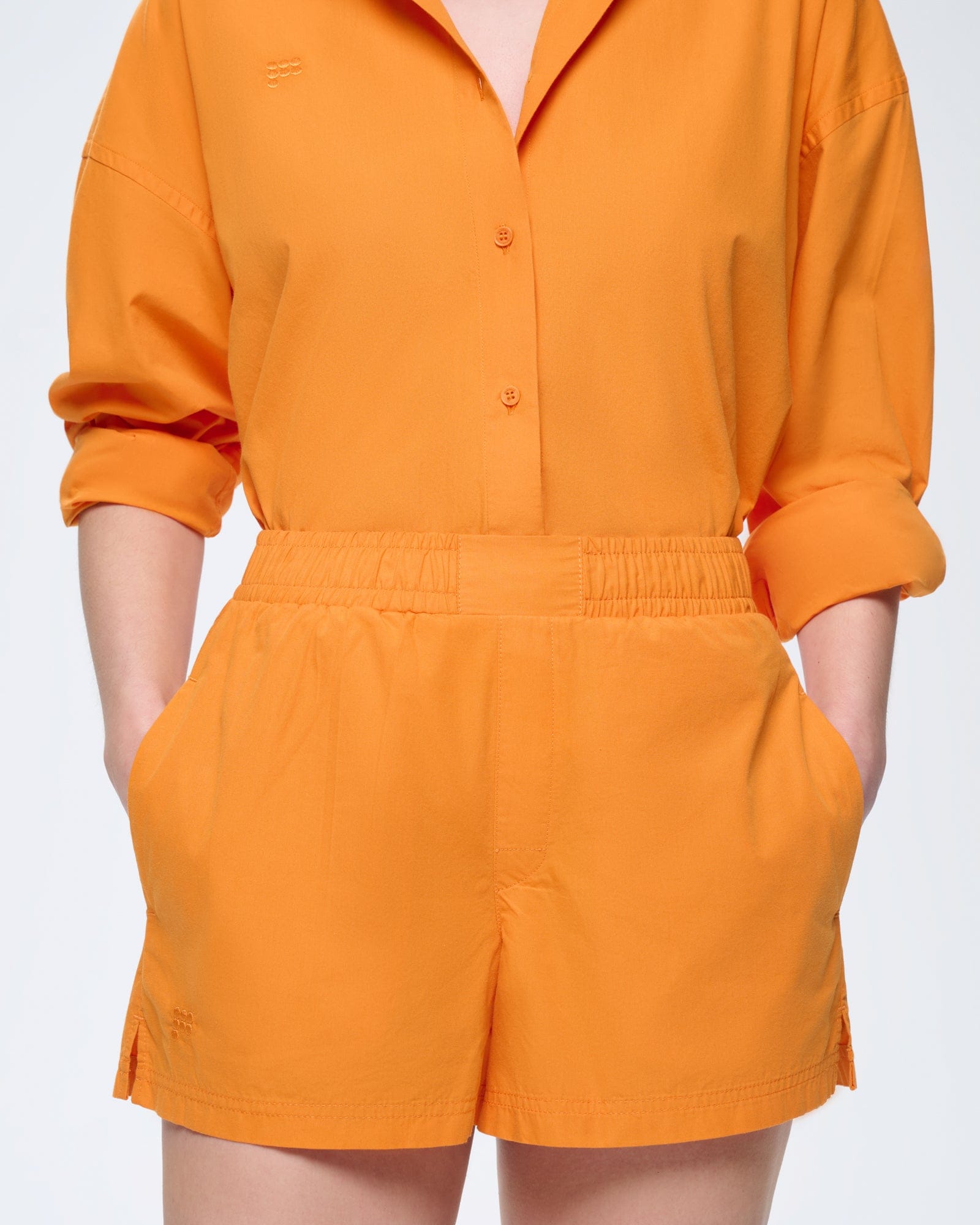 Womens Saffron Orange 100% organic cotton poplin shorts. Relaxed fit, elasticated waist, side pockets, tonal logo.