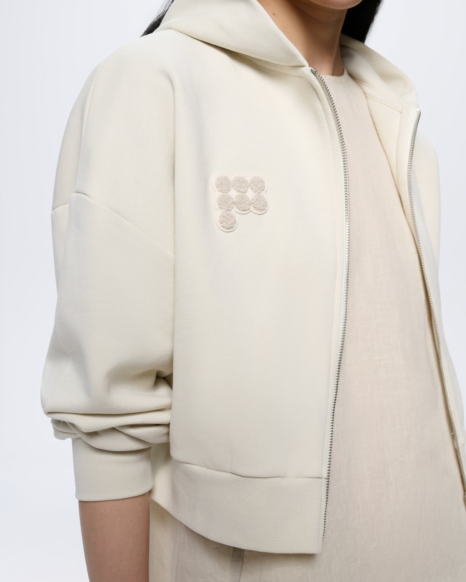 Womens Cropped Zip Up Hoodie Bone White, oversized 100% organic cotton, ribbed cuffs, metal zipper, tonal logo