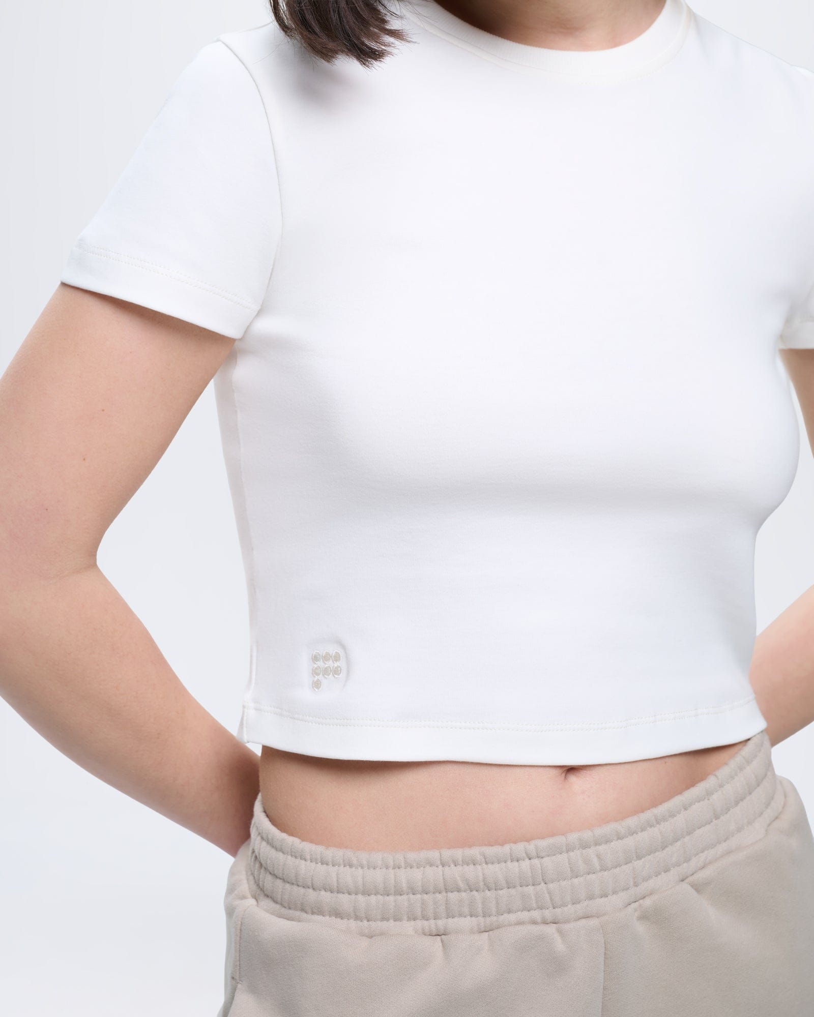 Premium Womens Off-White Cropped T-Shirt. Organic cotton, slim fit, crew neck, short sleeves, tonal P logo