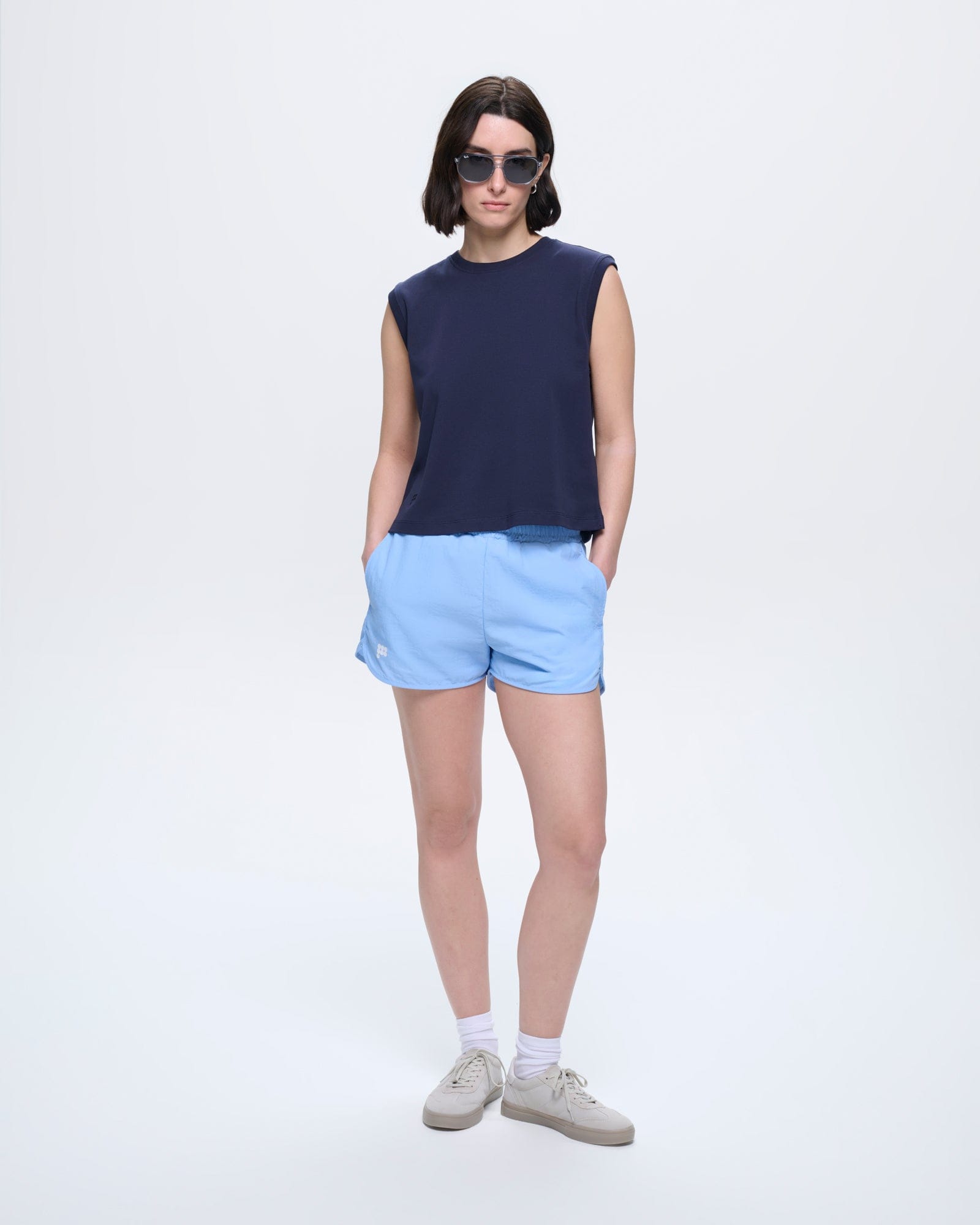 Model in Midnight Navy Womens Sleeveless T-Shirt. Relaxed fit, smooth 100% organic cotton, crew neck, tonal P logo
