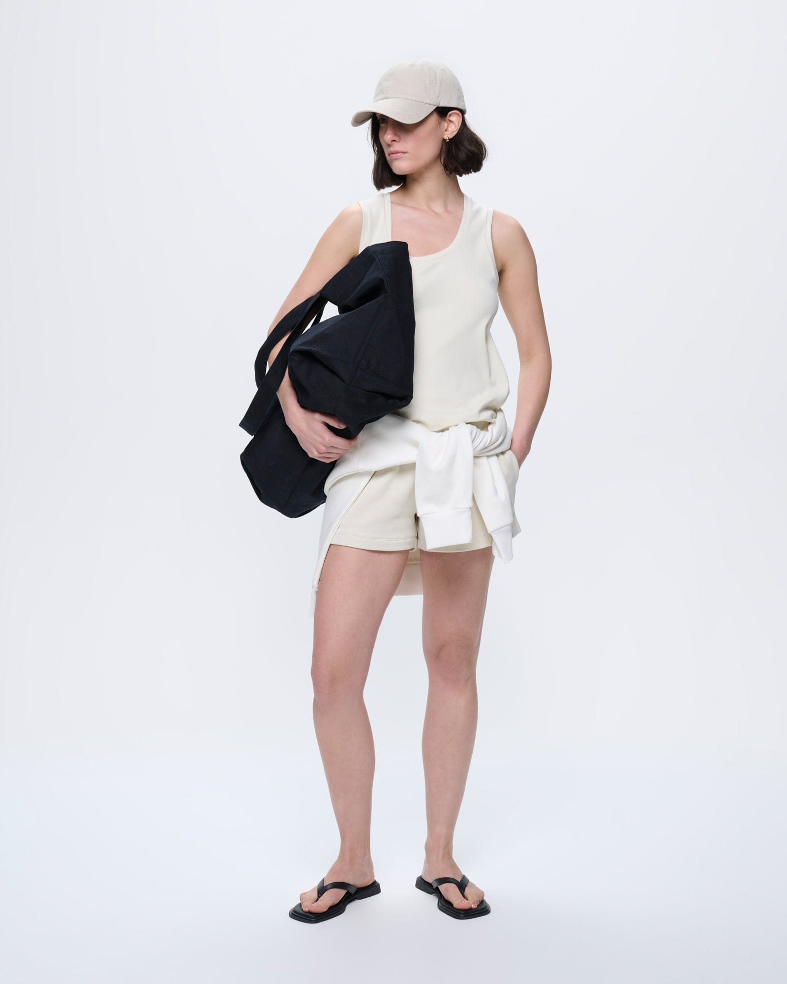 Womens Bone White organic cotton tank top with a scoop neck and relaxed fit, worn by a model
