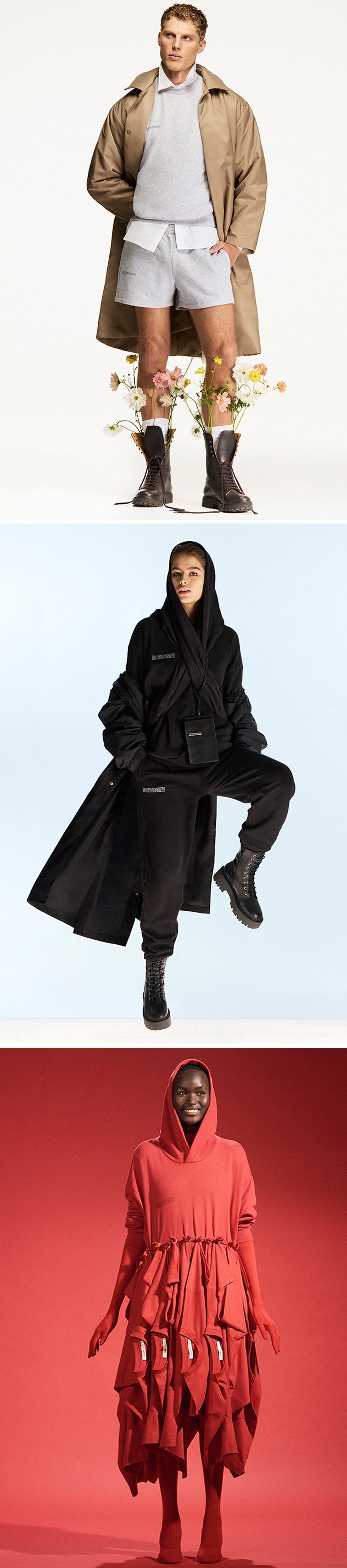 Male model tan trench coat, grey sweatshirt, shorts. Female in black hooded coat, sweatpants. Female in red tiered hooded dress. Modern fashion