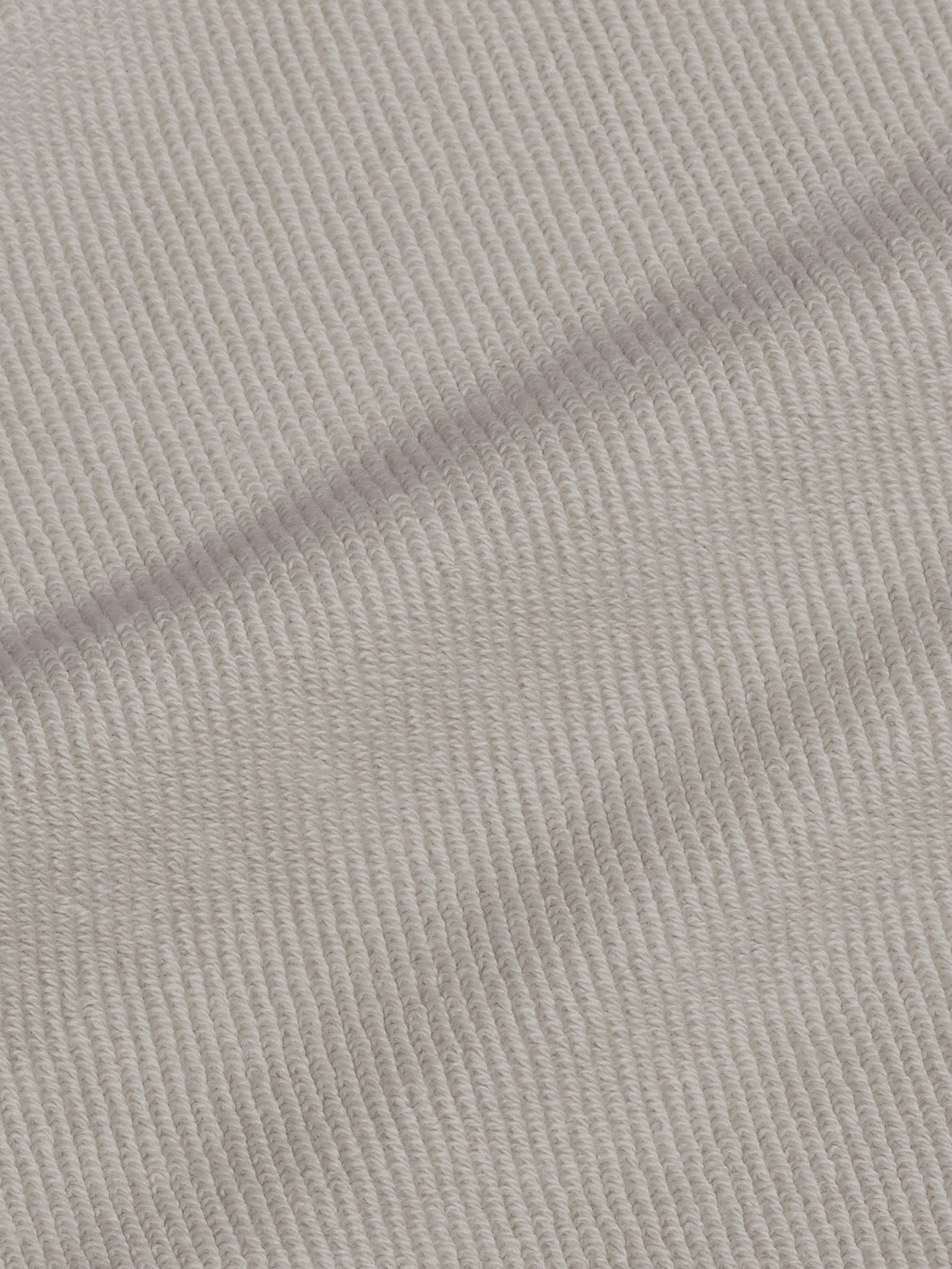 Close-up of stone ribbed organic cotton fabric texture for Archive Baby 365 Track Pants, treated with PPRMINT