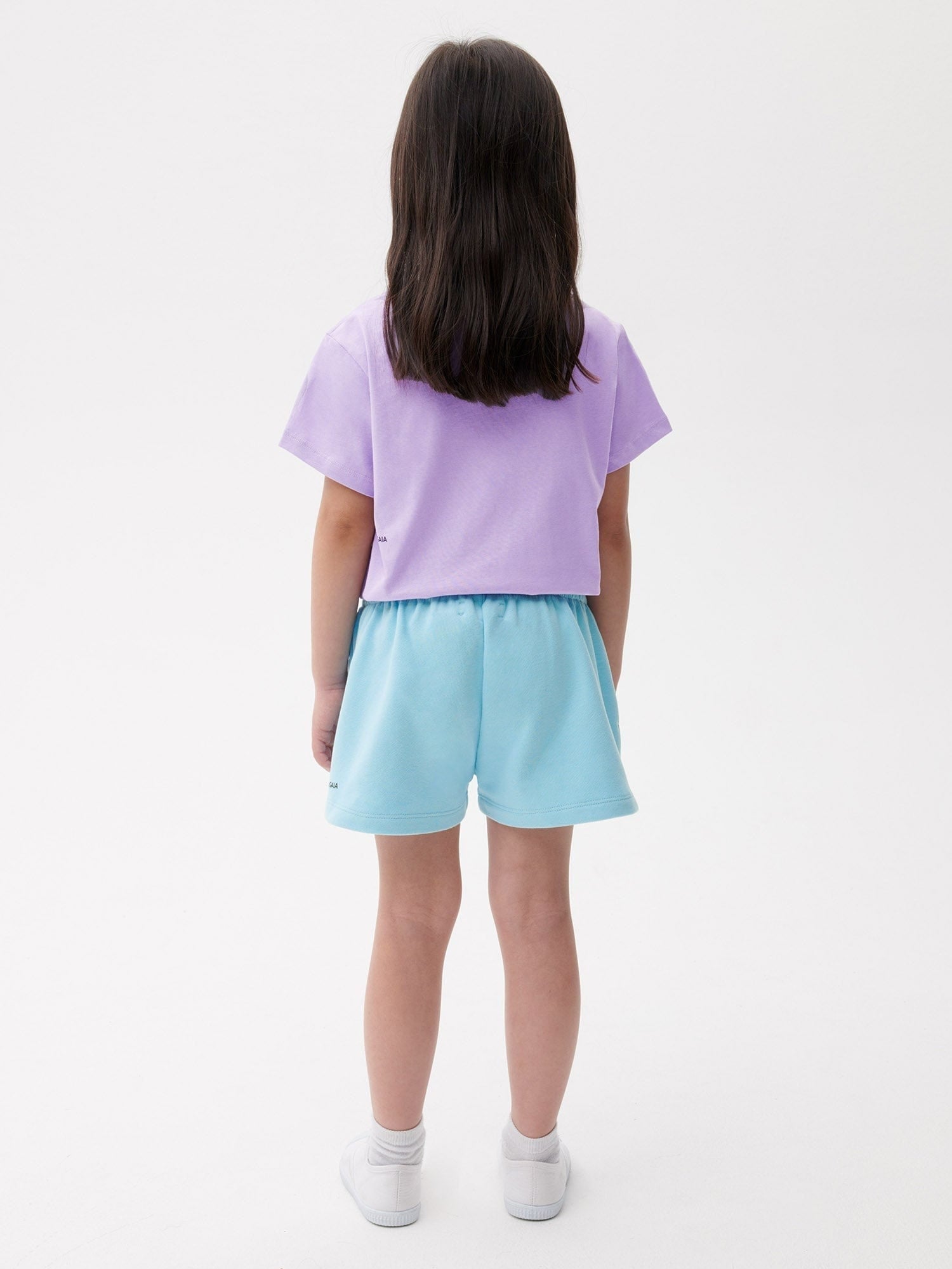 Kids' lavender cropped cotton tee with light blue loopback cotton athletic shorts, relaxed fit, comfortable style, rear view