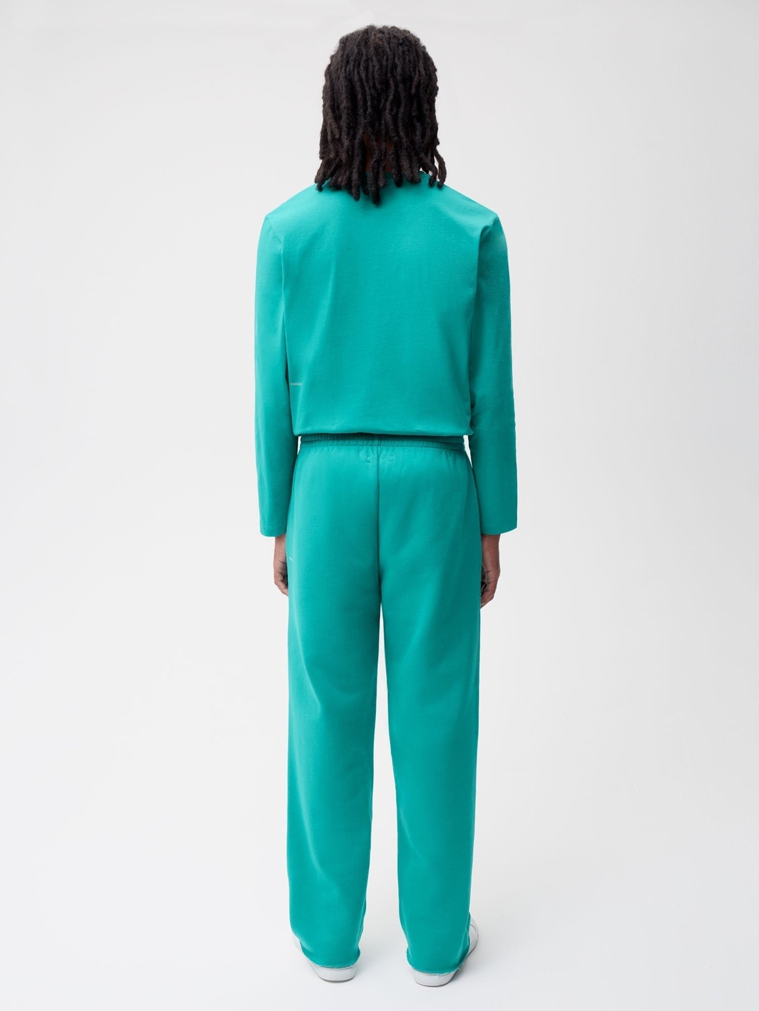 Aqua green cropped long sleeve sweatshirt and matching relaxed wide leg sweatpants co-ord set, model from behind